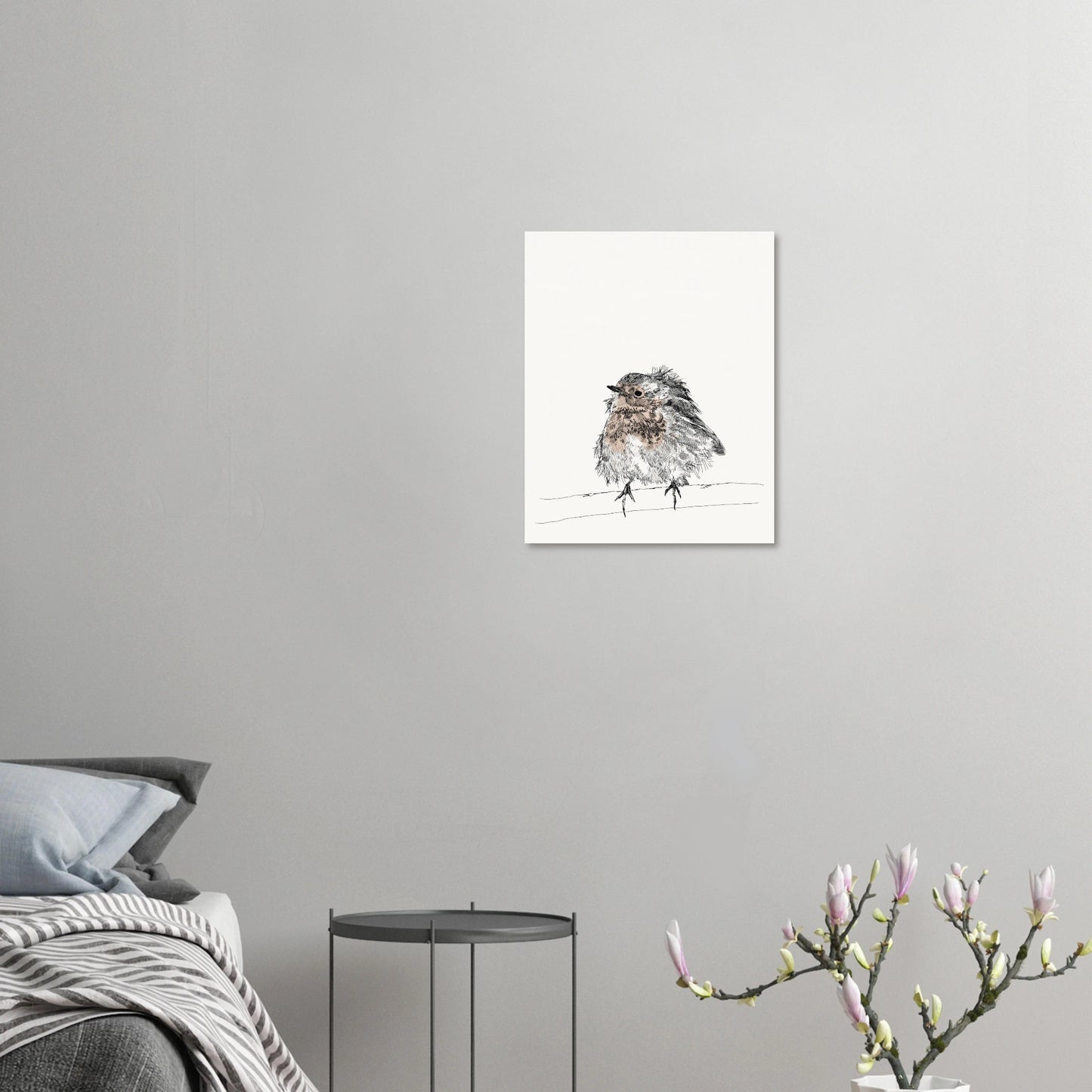 printed line black and white drawing of a robin with puffed out messy feathers perched on a branch. the breast is highlighted in a gentle red