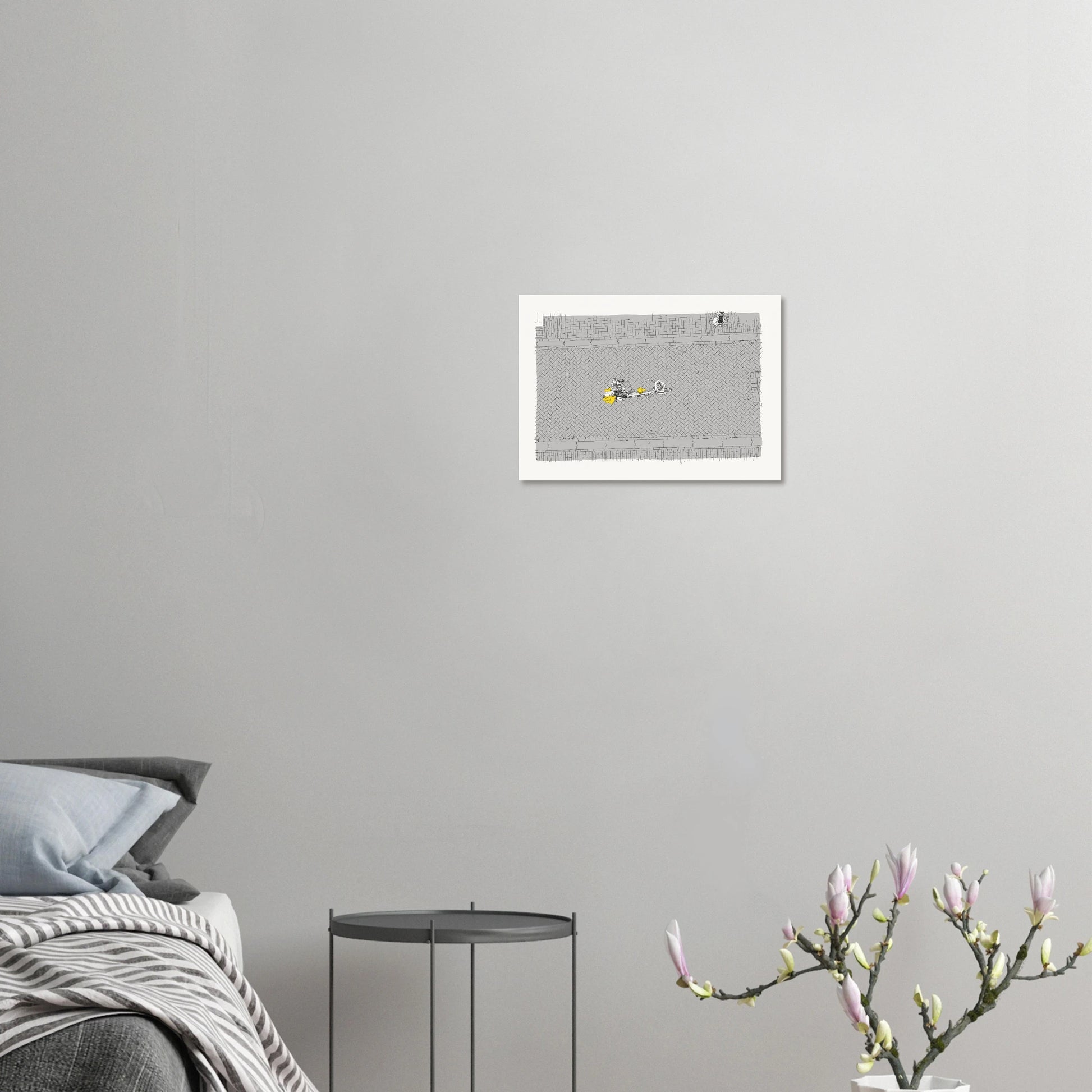 Birds' eye view of a single cyclist on the back of a tandem on a cobbled Amsterdam street. Black and white with the cyclist's coat highlighted in yellow